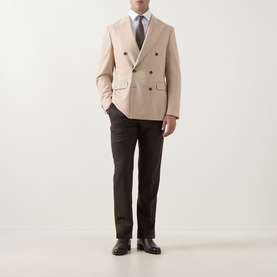 Model wearing Canali D8 Double-Breasted Blazer in Navy, styled with dark trousers, tie and black dress shoes.
