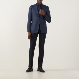 Model wearing Canali D8 Herringbone Single-Breasted Suit Jacket in Navy Nights, styled with matching trousers, dark shirt, tie, and black loafers.