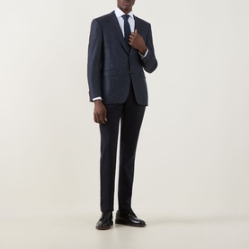 Model wearing Canali D8 Mini Check Single-Breasted Suit Jacket in navy wool, styled with matching trousers, white shirt and tie.