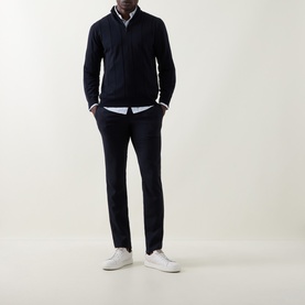 Model wearing Canali Textured Half-Zip Sweater in navy, styled with a white shirt, navy trousers and white trainers.
