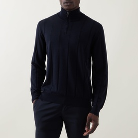 Model wearing Canali Textured Half-Zip Sweater in navy, featuring funnel neck, half-zip placket and ribbed trims. Styled with navy trousers.