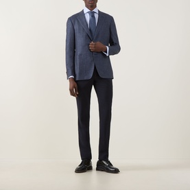 Model wearing Canali D7 Kai Single-Breasted Suit Jacket in blue, styled with navy trousers, white shirt, blue tie and black leather shoes