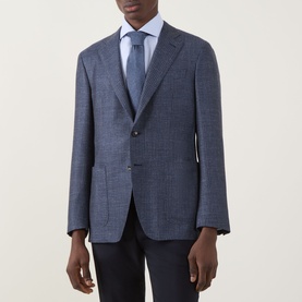 Model wearing Canali D7 Kai Single-Breasted Suit Jacket in blue check wool blend, styled with light blue shirt and tie