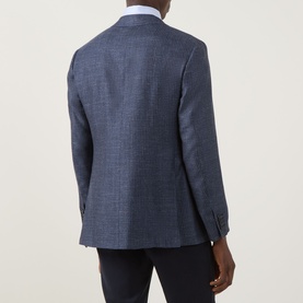 Model wearing Canali D7 Kai Single-Breasted Suit Jacket in blue, rear view showing notch lapel, buttoned cuffs and rear vents, styled with white