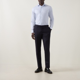 Model wearing Canali Broken Check Single-Cuff Shirt in blue with semi-spread collar, styled with navy trousers and dark loafers.
