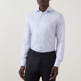 Model wearing Canali Broken Check Single-Cuff Shirt in blue with semi-spread collar and front button placket, styled with navy trousers.