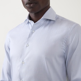 Model wearing Canali Broken Check Single-Cuff Shirt in blue, featuring semi-spread collar and subtle broken check pattern, close-up detail shot.