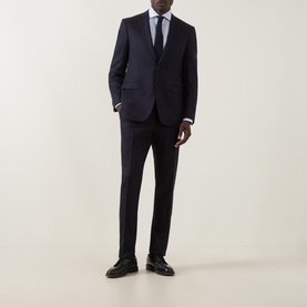 Model wearing Canali blue broken check single-cuff shirt with semi-spread collar, styled with navy suit and black leather shoes.