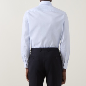 Model wearing Canali Light Blue Single Cuff Regular formal shirt, 100% cotton, paired with navy trousers. Rear view.