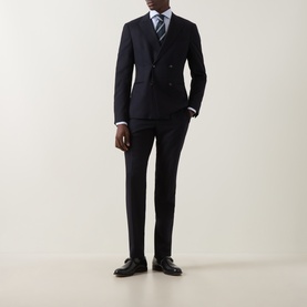 Model wearing Canali light blue single cuff regular cotton shirt, styled with navy double-breasted suit and striped tie.