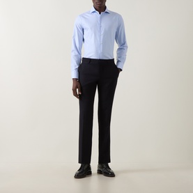 Model wearing Canali blue single cuff regular cotton formal shirt with navy tailored trousers and black leather shoes.