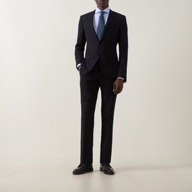 Model wearing Canali blue single cuff regular cotton formal shirt, styled with dark navy suit and blue tie, black leather shoes.