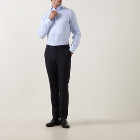 Model wearing Canali Light Blue Single Cuff Regular cotton formal shirt, styled with navy tailored trousers and black leather shoes.