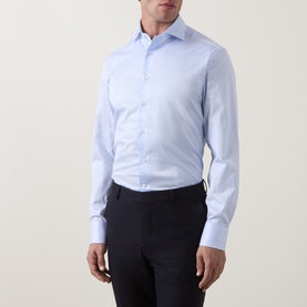 Model wearing Canali light blue cotton formal shirt with single cuff, styled with navy trousers