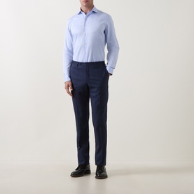 Model wearing Canali blue single cuff regular cotton formal shirt with navy tailored trousers and black leather shoes.