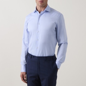 Model wearing Canali blue single cuff regular cotton formal shirt with spread collar, styled with navy trousers.