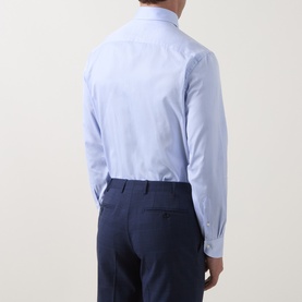 Model wearing Canali blue single cuff regular cotton formal shirt, styled with navy tailored trousers. Rear view.