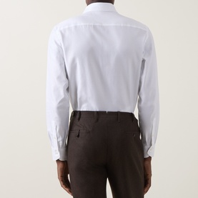 Model wearing Canali white single cuff regular fit formal shirt, 100% cotton, styled with dark brown trousers. Rear view.