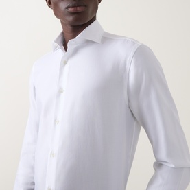 Model wearing Canali white single cuff regular fit cotton formal shirt with spread collar, close-up view showing button placket and cuffs.