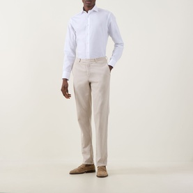 Model wearing Canali Travel Stretch Single-Cuff Shirt in white with cutaway collar, styled with stone chinos and tan suede loafers.