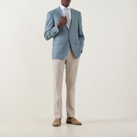 Model wearing Canali Travel Stretch Single-Cuff Shirt in white, styled with a light blue check blazer and stone chinos.