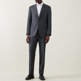 Model wearing Canali Drop 6 Griz Two-Piece Suit in grey wool, single-breasted jacket with notch lapels, slim-leg trousers, styled with white shirt