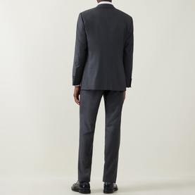 Model wearing Canali Drop 6 Griz Two-Piece Suit in grey, rear view, styled with white shirt and black dress shoes.