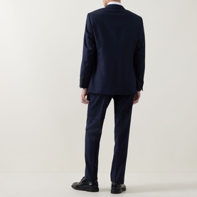 Model wearing Canali dark blue suit, rear view, styled with white shirt and black dress shoes