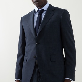 Model wearing Canali navy wool suit jacket, styled with light blue shirt and dark tie