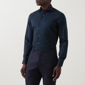 Model wearing Canali navy single cuff regular shirt with spread collar, styled with navy trousers.