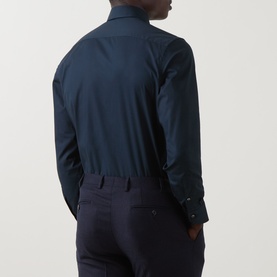 Model wearing Canali navy single cuff regular shirt, rear view, styled with navy trousers. Long sleeves with button cuffs.