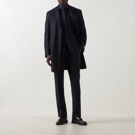 Model wearing Canali navy single cuff regular shirt, styled with navy overcoat, suit trousers, and dark loafers.