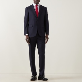 Model wearing Canali D6 Pinstripe Two-Piece Suit in navy, styled with a white shirt, red tie, and black oxford shoes.