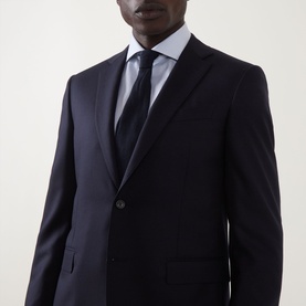 Model wearing Canali D8 Flannel Two-Piece Suit in navy, single-breasted jacket with notch lapel, styled with white shirt and dark tie
