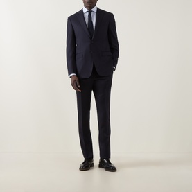 Model wearing Canali D8 Flannel Two-Piece Suit in navy, styled with white shirt and dark tie, paired with black leather shoes.