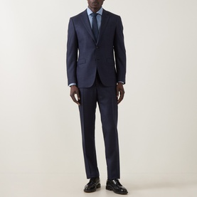 Model wearing Canali D8 Textured Two-Piece Suit in navy, styled with a light blue shirt, blue tie, and black loafers.