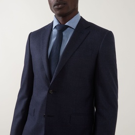 Model wearing Canali D8 Textured Two-Piece Suit in navy, single-breasted notch lapel jacket, styled with light blue shirt and tie.