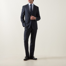 Model wearing Canali D8 Tonal Check Two-Piece Suit in navy, styled with white shirt, blue tie and black dress shoes.