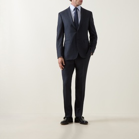 Model wearing Canali D8 Tonal Check Two-Piece Suit in navy wool, styled with a light blue shirt, grey tie and black leather shoes.