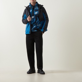 Model wearing Columbia Helvetia&trade; II Printed Half Snap Fleece in Phoenix Blue, styled with a dark jacket, black trousers and trainers.