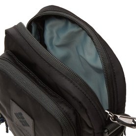 Columbia black nylon crossbody bag, open top view showing teal interior lining, silver zip hardware and logo patch detail