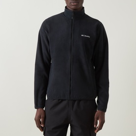 Model wearing Columbia Pacific Arch Logo 200 Zip Fleece Jacket in black with zip fastening, side pockets and small chest logo, styled with black