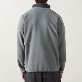 Model wearing Columbia Sequoia Grove II Half Zip Fleece Jacket in Sedona Sage/Shark, showing rear colour-blocked design with elasticated hem.
