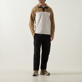 Model wearing Columbia Steens Mountain II Half Snap Fleece in Dark Stone/Delta colourblock, with black cargo trousers and trail trainers.