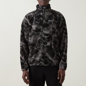 Model wearing Columbia fleece in Black Icepeaks, half-zip funnel neck with abstract cloud print in dark grey tones.