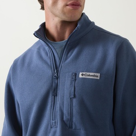 Model wearing Columbia Sweater Weather&trade; II Fleece Jacket in Dark Mountain, showing half-zip fastening and zipped chest pocket detail.