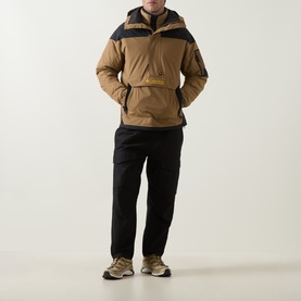 Model wearing Columbia Challenger II Pullover Anorak in Delta/Black colourblock, styled with black cargo trousers and trail trainers