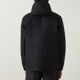 Model wearing Columbia black hooded jacket, back view, with matching black trousers