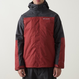 Model wearing Columbia Hikebound&trade; II 3-in-1 Waterproof Jacket in Red Oxide and Shark colourblock, with fixed hood and zip pockets.