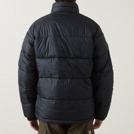 Model wearing Columbia Pike Lake II Puffer Jacket in black, rear view showing quilted panels, stand collar and long sleeves